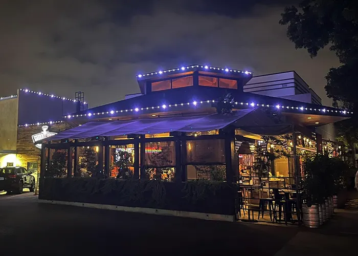 Restaurant with white permanent architectural lighting