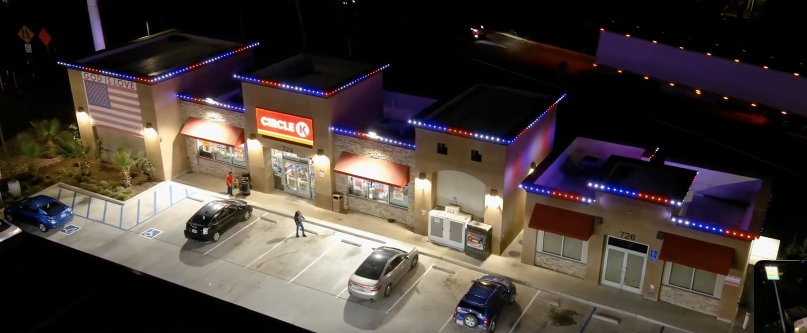 Commercial shopping center with permanent roofline lighting